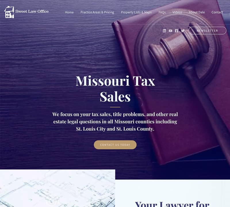 Image of website for a law firm with a photo of a gavel in the background. There is a navy blue overlay and white text and gold buttons.