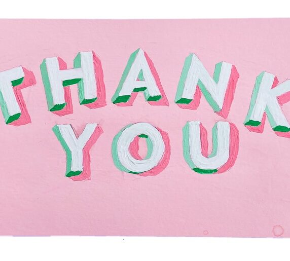 Hand-painted 3D block letters that say "Thank You" with green shaded sides and a bubblegum pink background